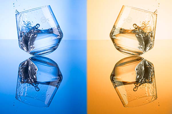 afbeelding van dansende glazen op blauwe en oranje achtergrond